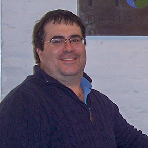 Smiling man wearing glasses in casual sweater