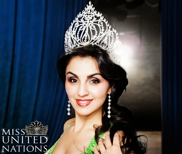 Smiling pageant contestant wearing jeweled crown