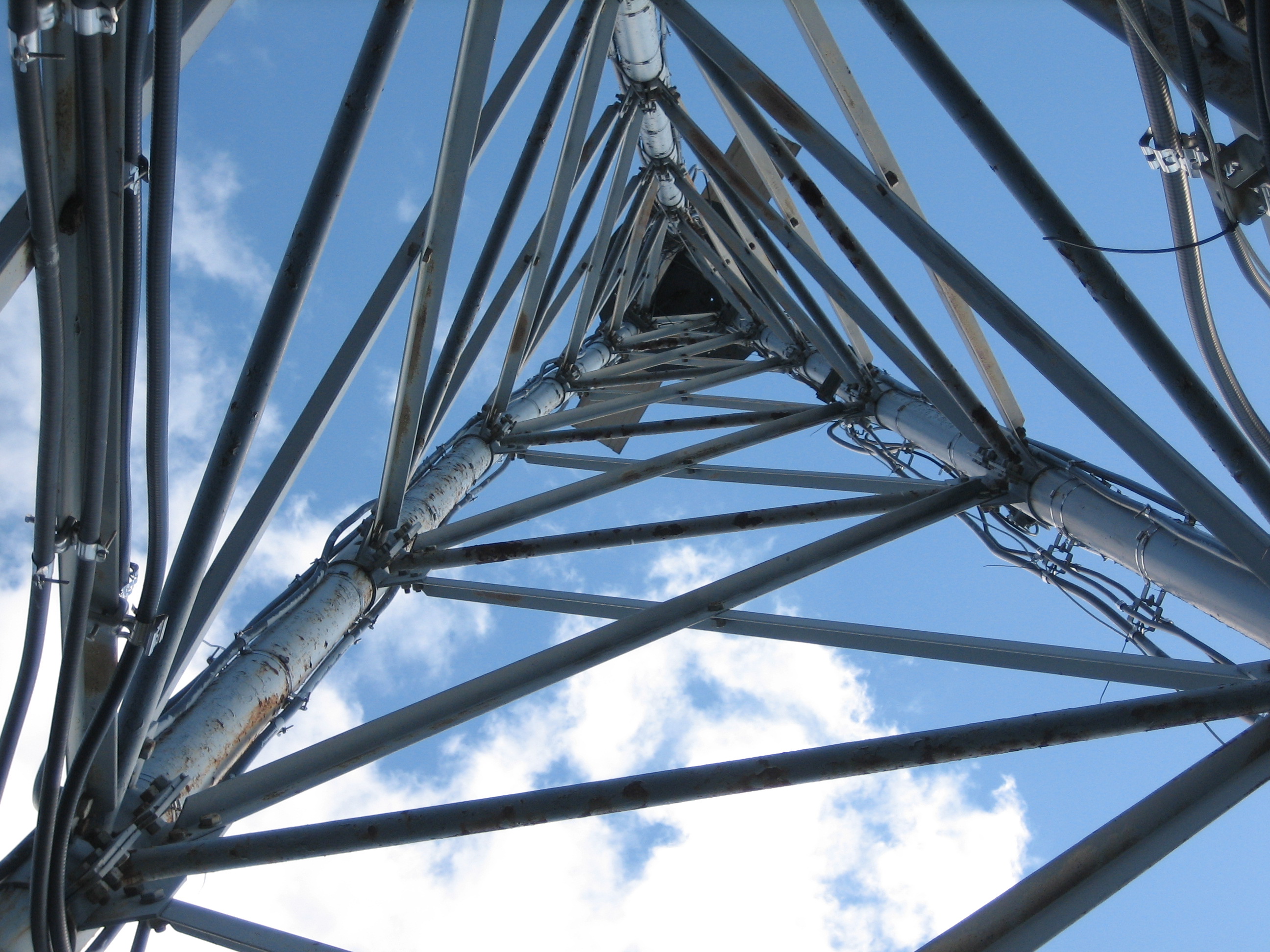 Upward view through steel lattice tower