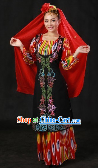Smiling woman wearing colorful dress and red veil